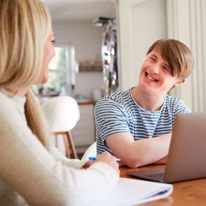 Support worker helping a participant